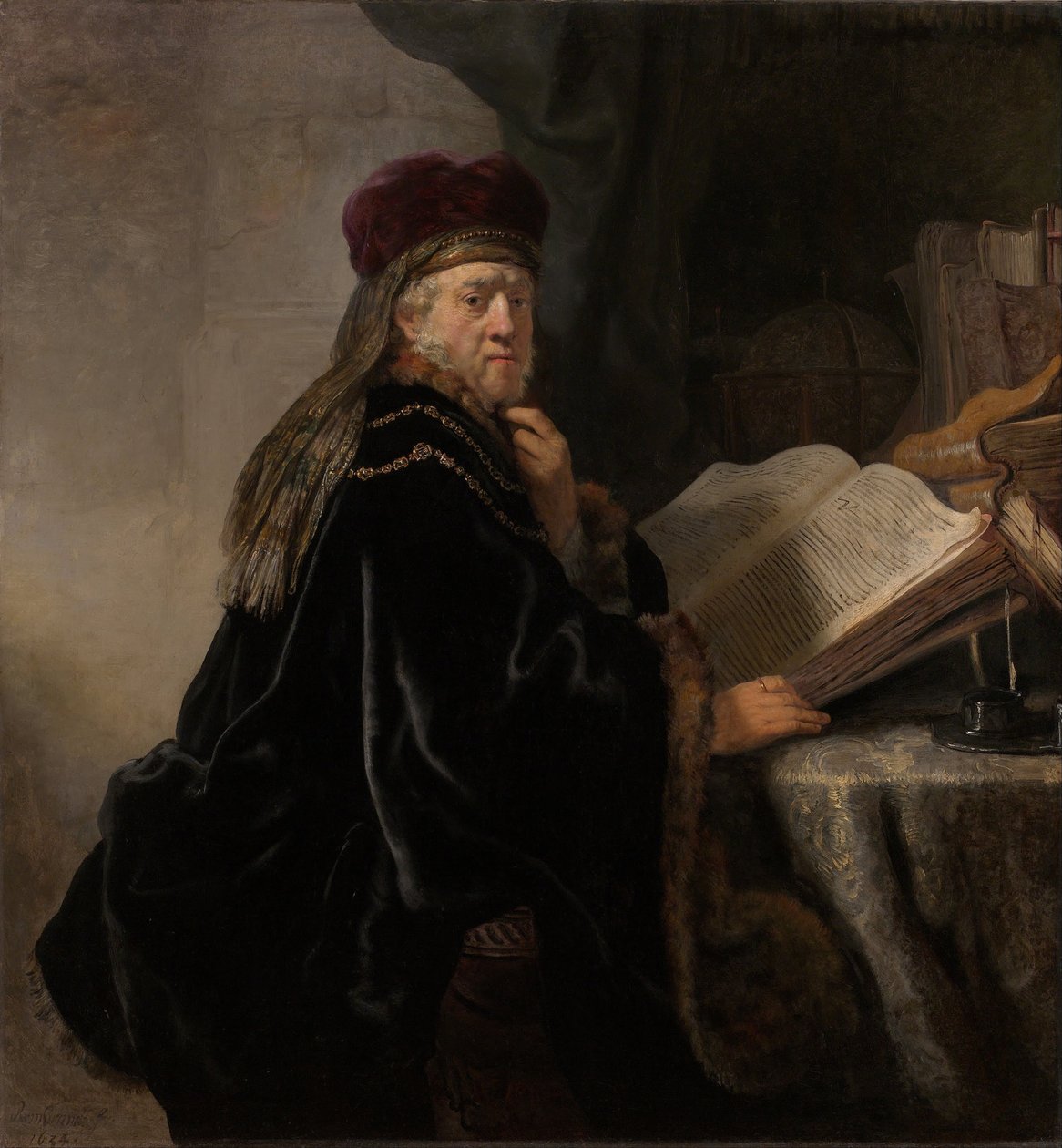 Učenec sedící u stolu Učenec ve své studii od Rembrandt van Rijn