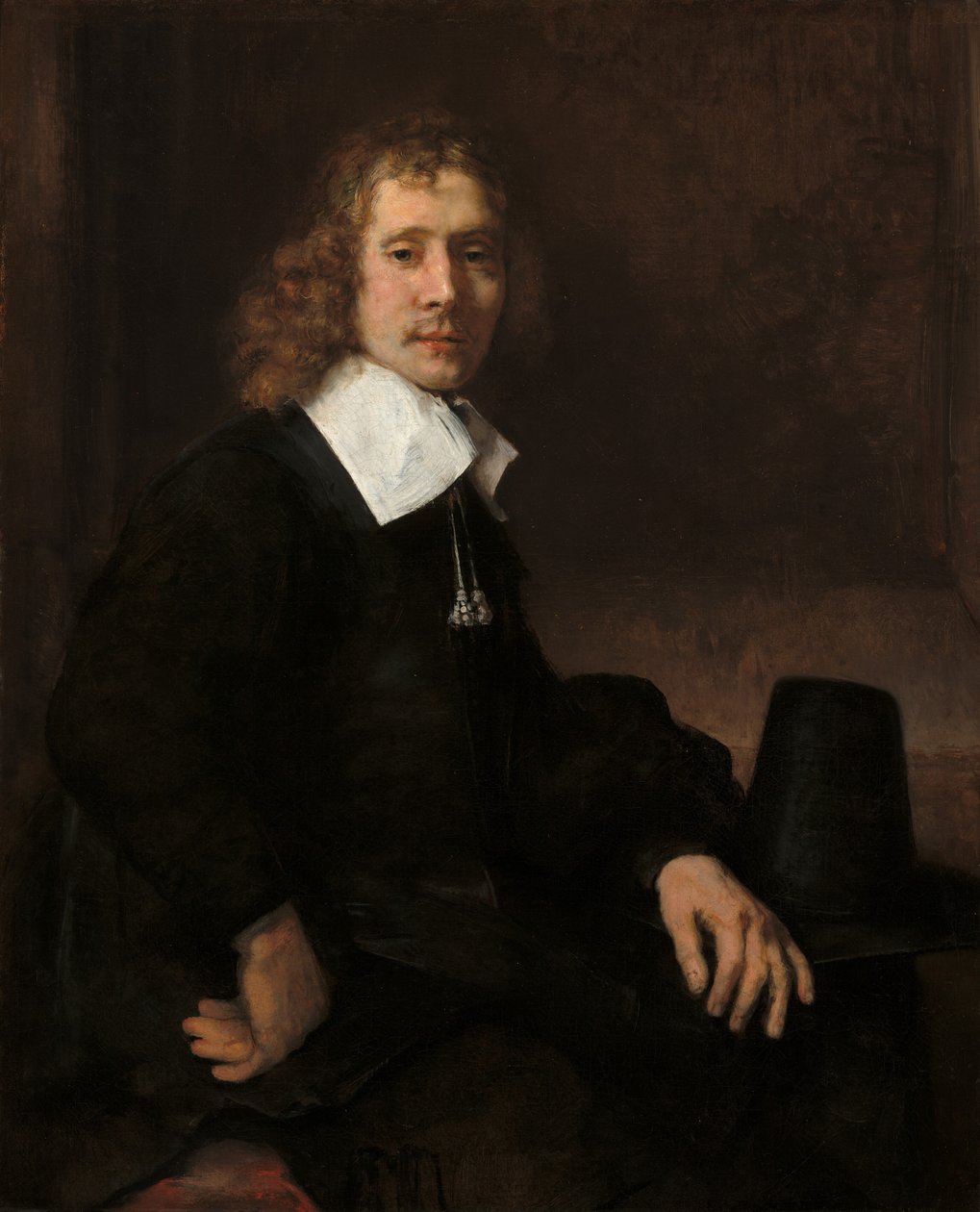 Mladý muž sedící u stolu pravděpodobně Govaert Flinck, c. 1660. od Rembrandt van Rijn