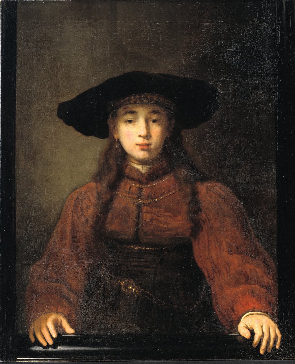 Mladá žena položila ruce na rám obrazu od Rembrandt van Rijn