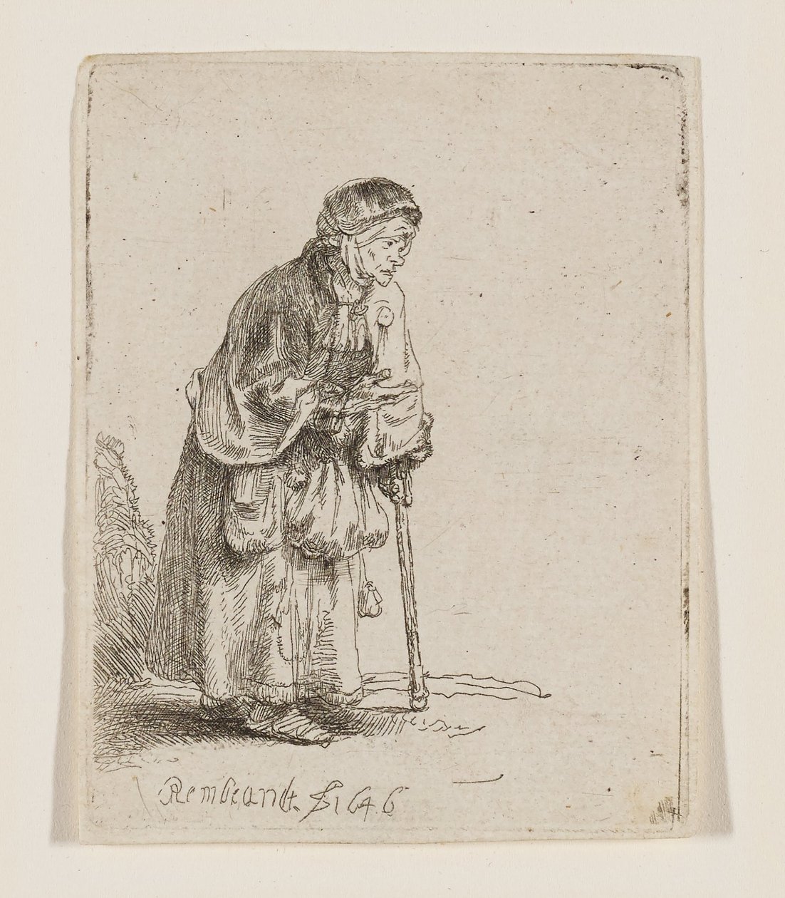 Žebračka opírající se o hůl od Rembrandt van Rijn