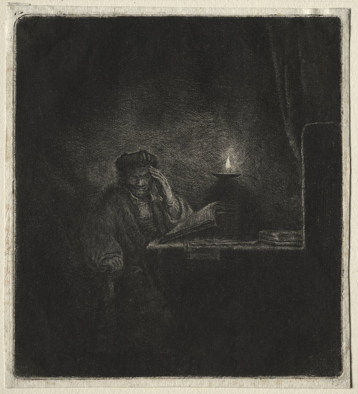 Kopie studenta u stolu při svíčkách od Rembrandt van Rijn