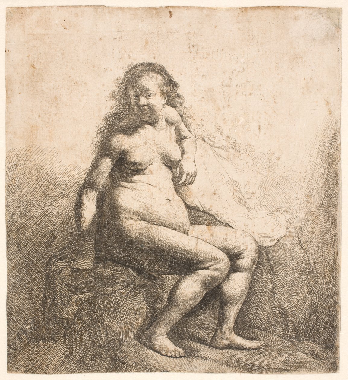 Nahá žena sedící na návrší od Rembrandt van Rijn