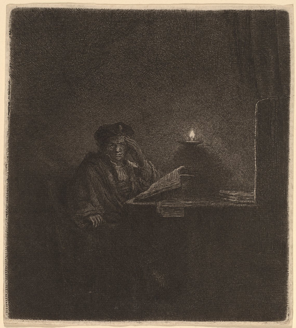 Student u stolu při svíčkách od Rembrandt van Rijn