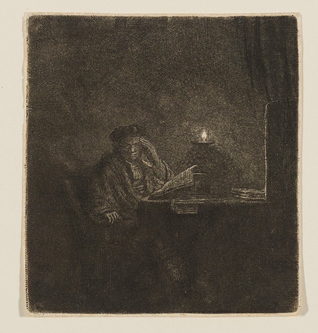 Student u stolu při svíčkách od Rembrandt van Rijn