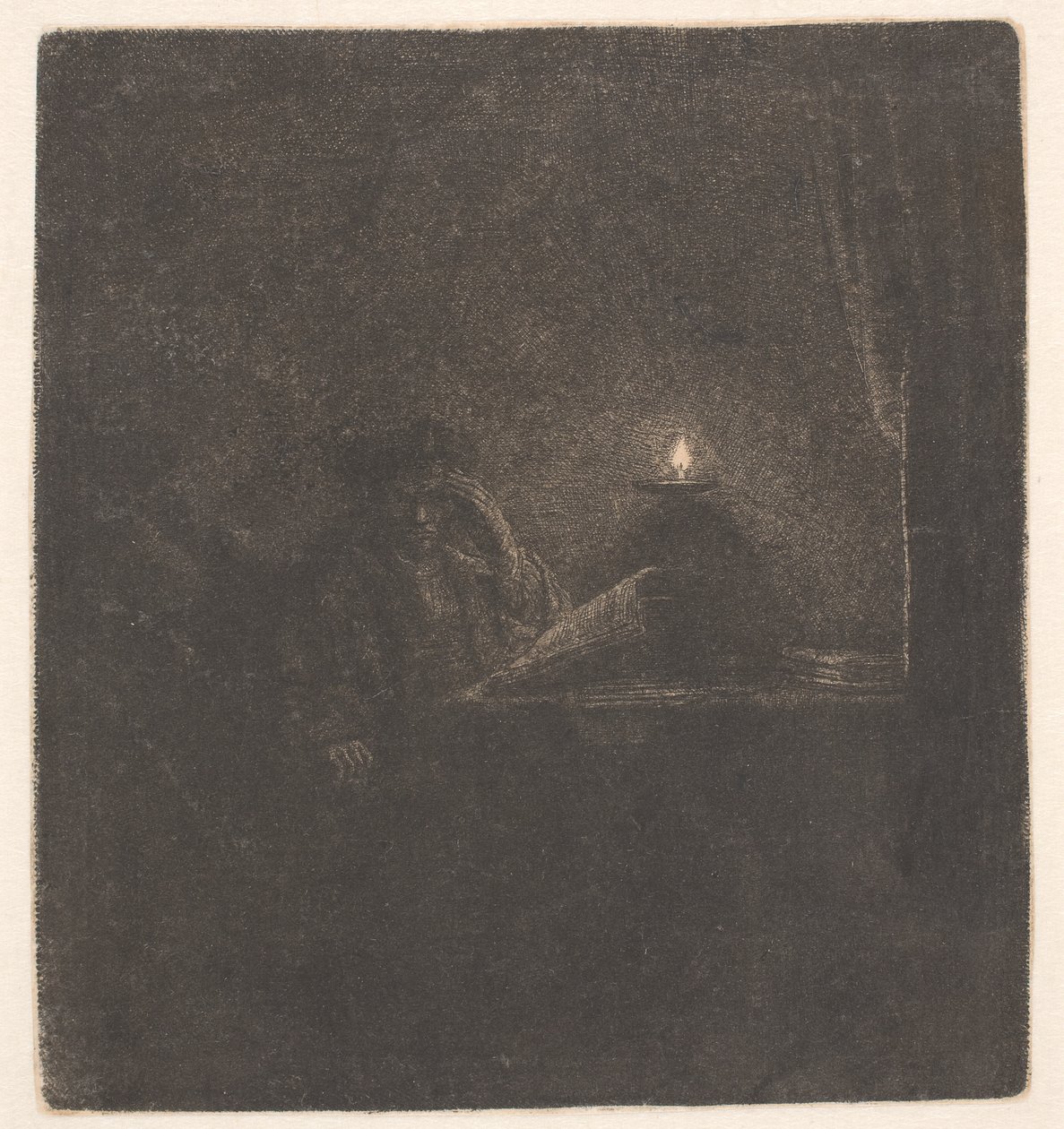 Student u stolu při svíčkách od Rembrandt van Rijn