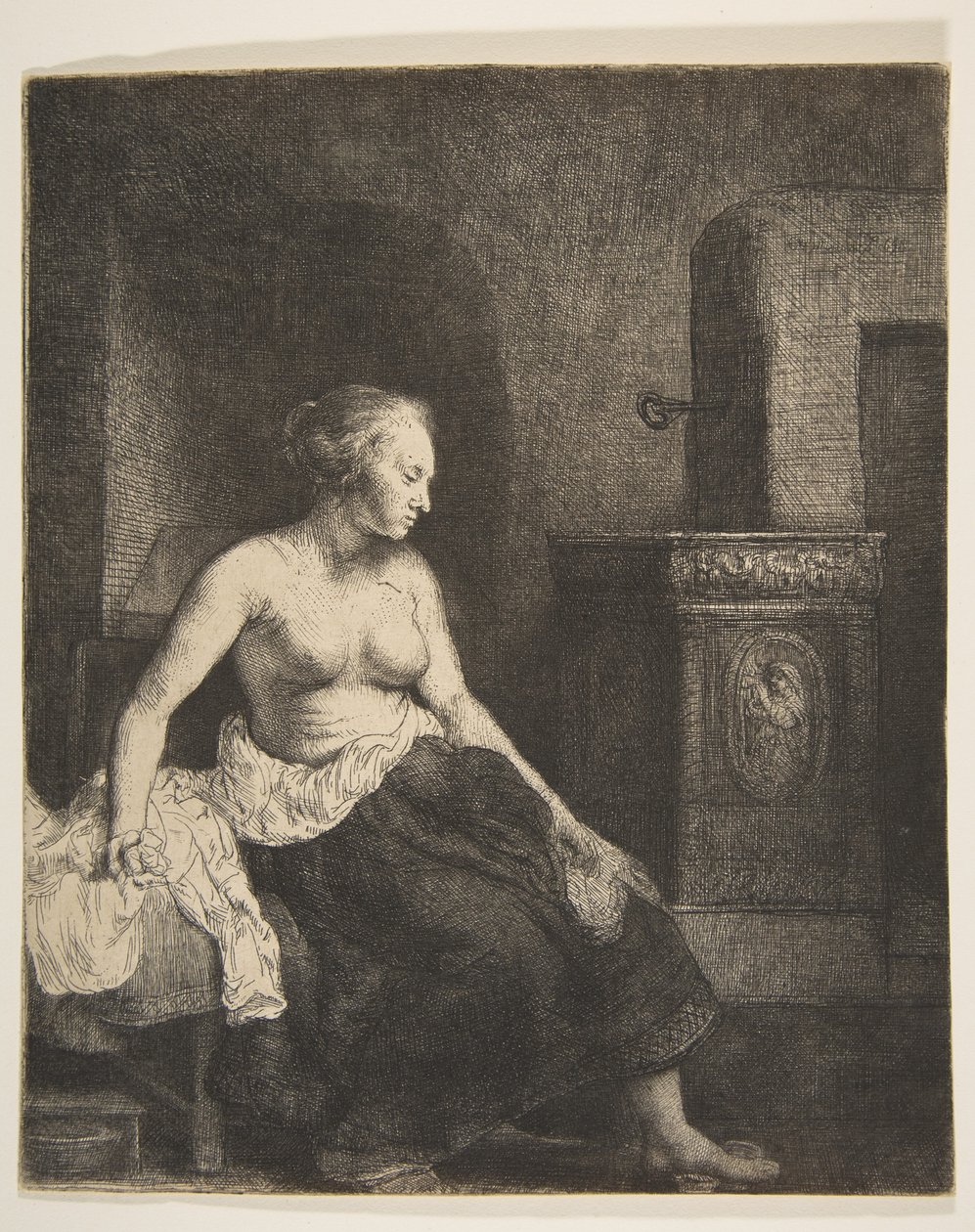 Žena sedí napůl oblečená vedle sporáku, 1658. od Rembrandt van Rijn