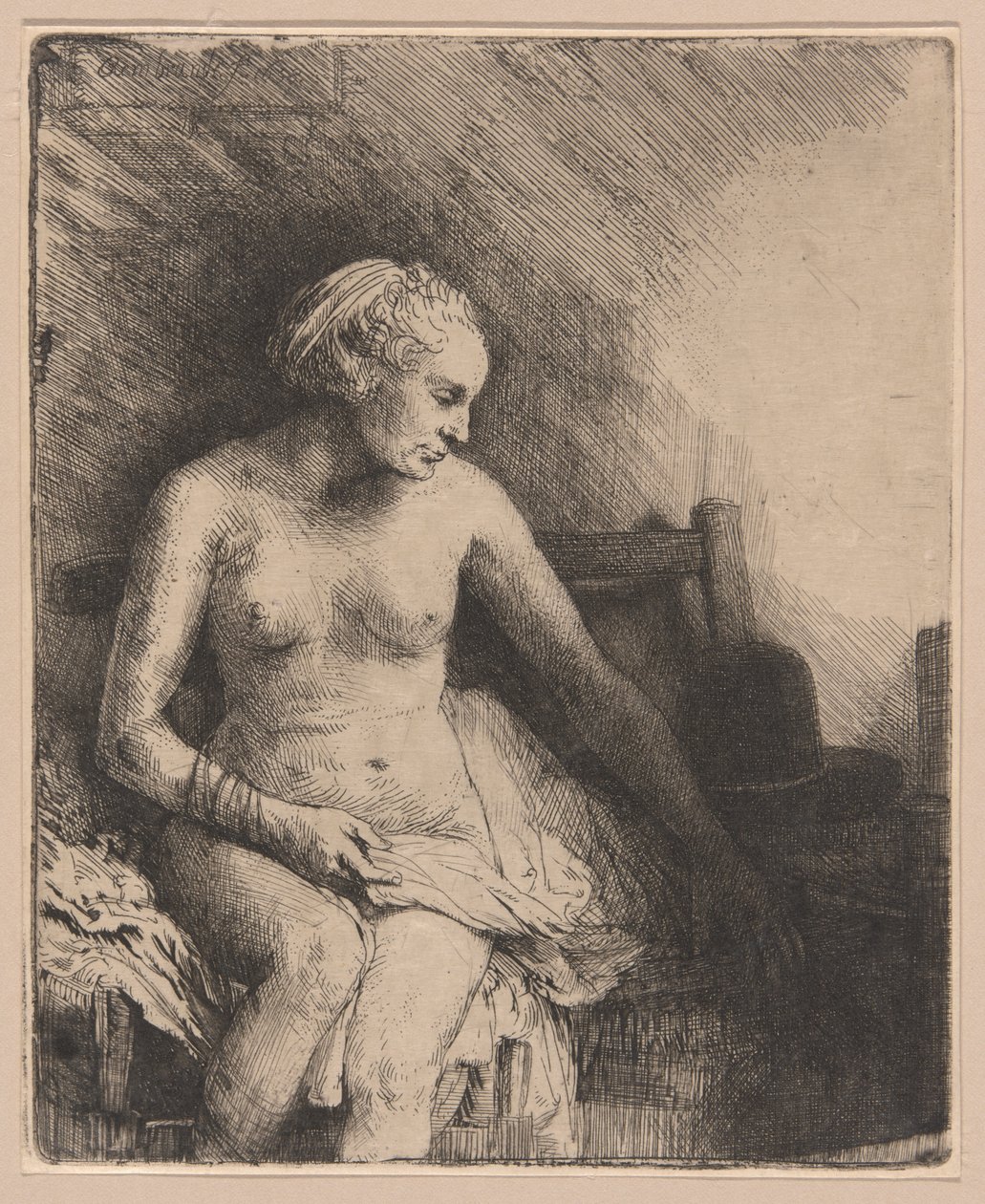 Žena ve vaně s kloboukem vedle ní od Rembrandt van Rijn