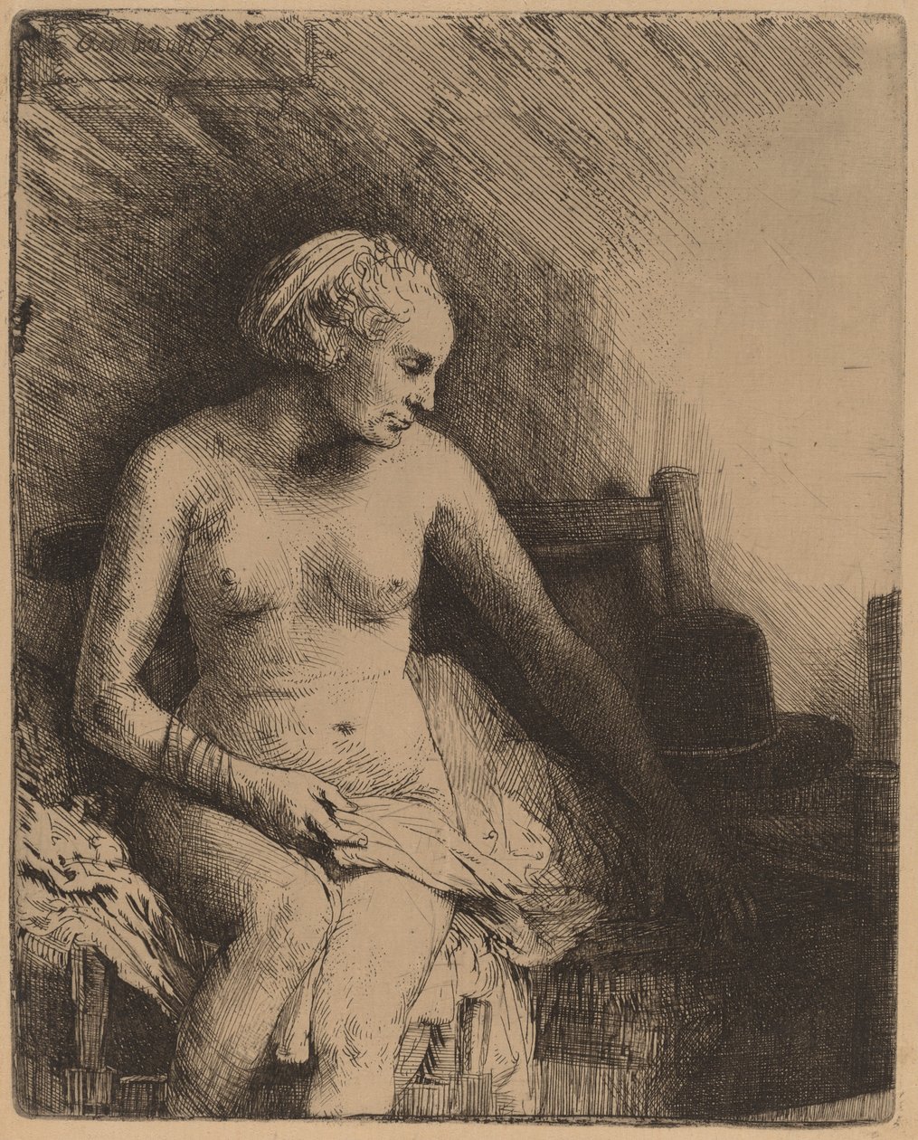Žena ve vaně s kloboukem vedle ní od Rembrandt van Rijn