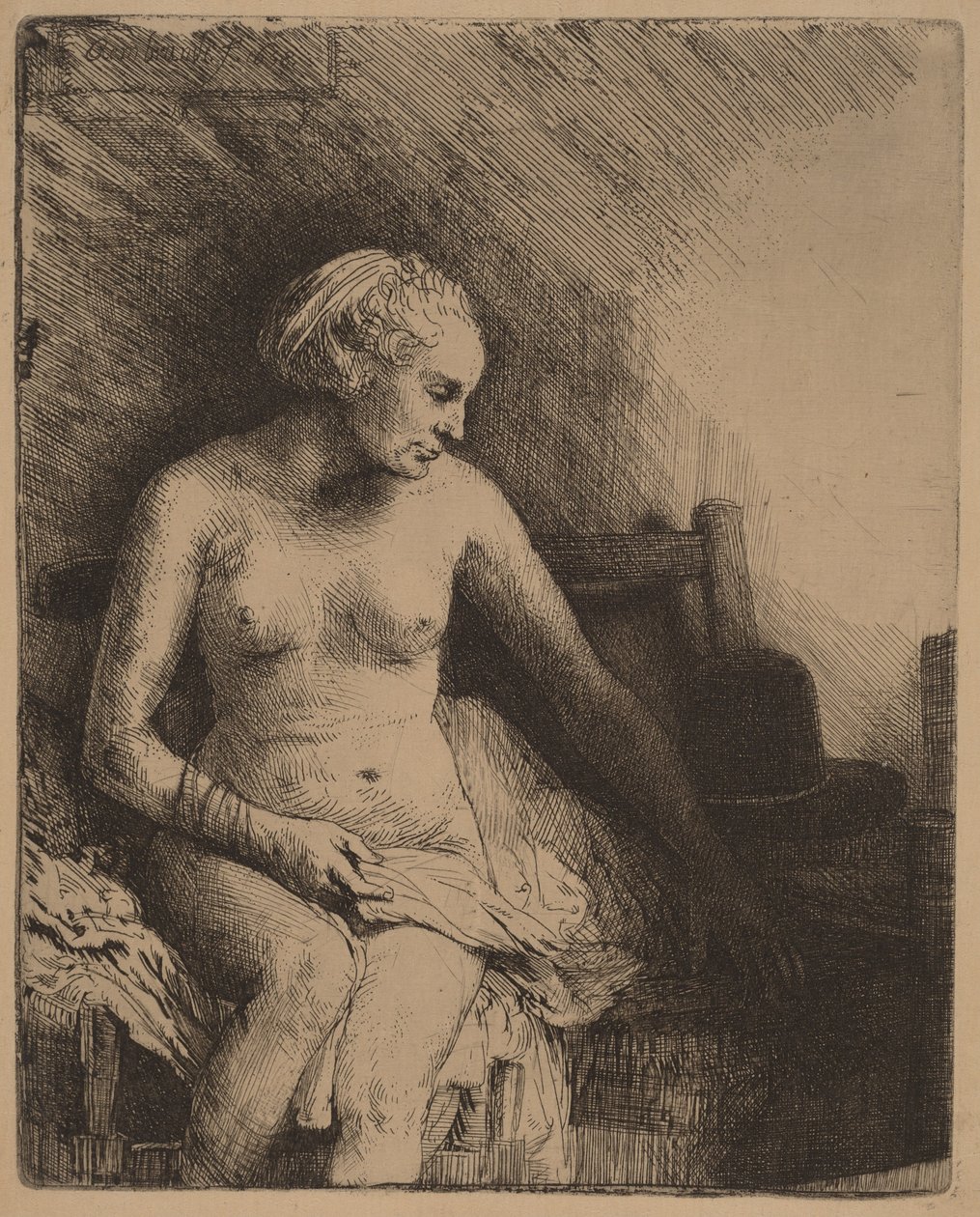 Žena ve vaně s kloboukem vedle sebe od Rembrandt van Rijn