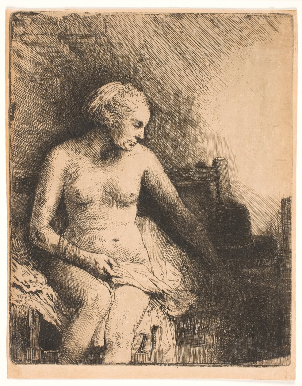 Žena ve vaně, s kloboukem vedle ní od Rembrandt van Rijn