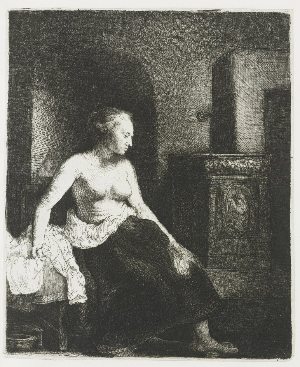 Žena sedí napůl oblečená vedle sporáku od Rembrandt van Rijn