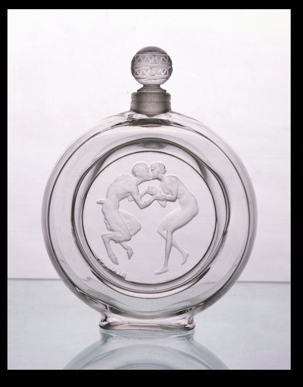 Le Baiser du Faune, čirý skleněný flakonek pro Molinard od Lalique od Rene Jules Lalique