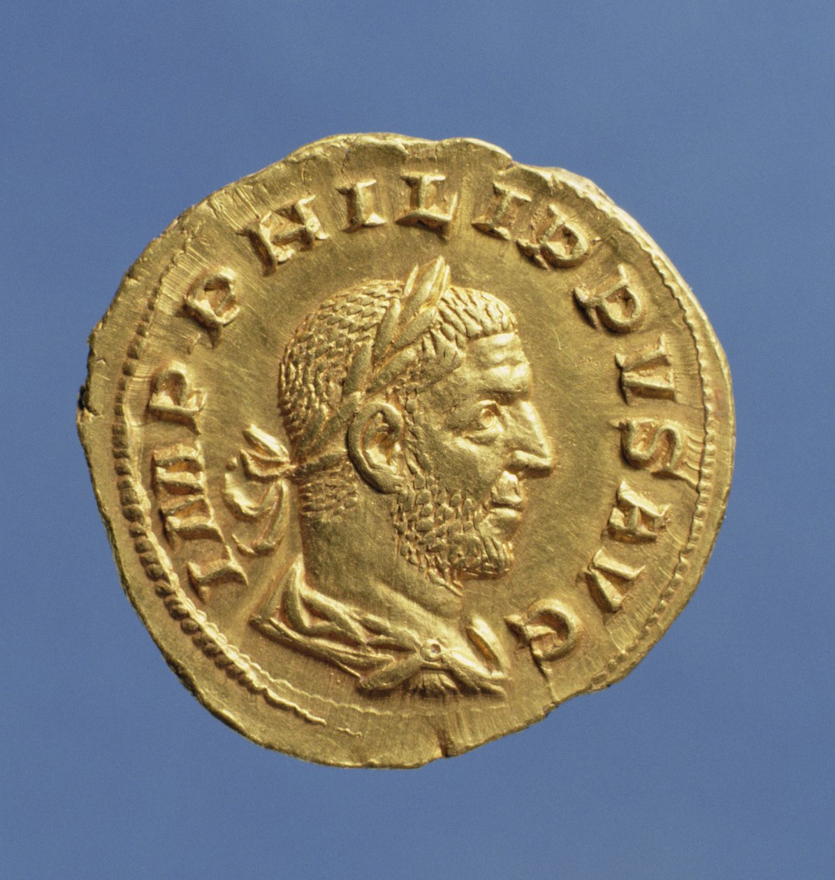 Aureus (avers) Filipa Araba (244-249) přehozený, s kyrysem, na sobě vavřínový věnec. Nápis: IMP PHILIPPVS AVG (zlato) od Roman