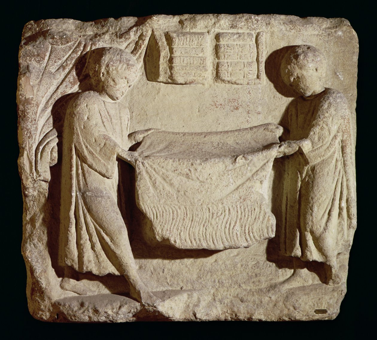 Reliéf zobrazující soukeníka v jeho obchodě od Roman