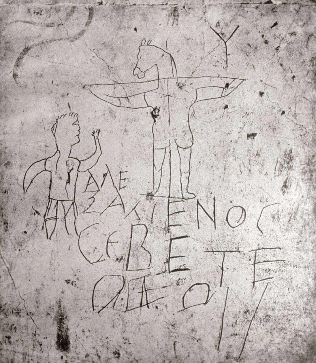 Rouhačské graffito Ukřižování (kámen) od Roman