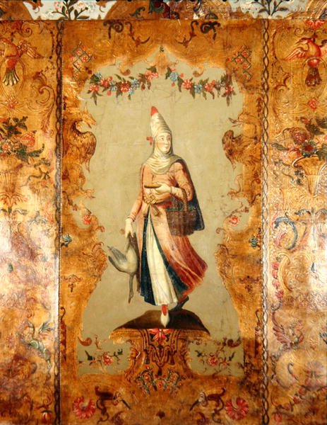 Tapeta zobrazující ženu v tradičním kroji (kůže) od School German