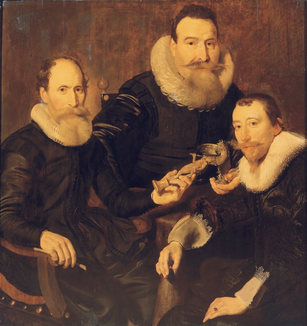 Skupinový portrét tří pánů, tříčtvrteční, sedících v černých kostýmech s krajkovým límcem, 1635 od Thomas de Keyser