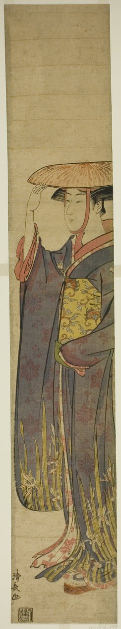 Mladá žena nosí klobouk od Torii Kiyonaga