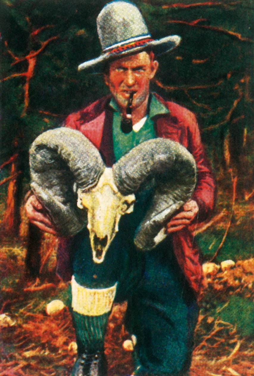 Lovec trofejí držící lebku ovce Bighorn, c1928. od Unbekannt
