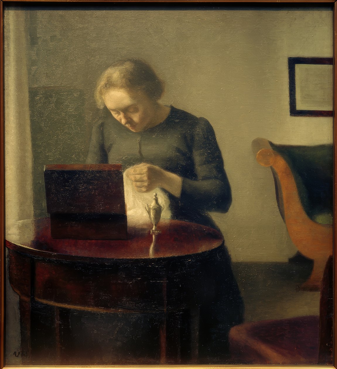 Umělcova žena u šicího stolu od Vilhelm Hammershoi