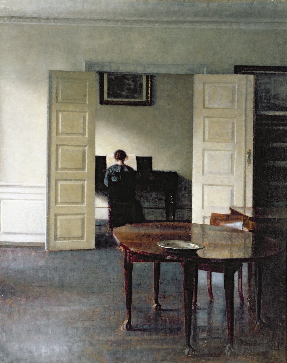 Interiér se ženou hrající na klavír, 1910 od Vilhelm Hammershoi