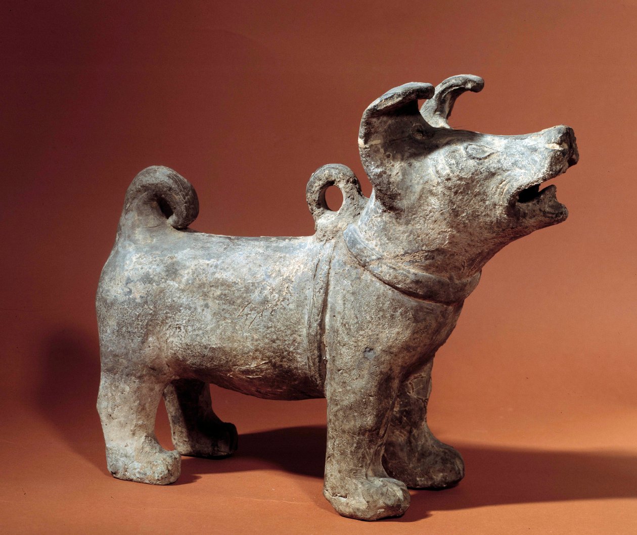 Chinese art: molosse with harness. Terracotta funeral statuette from the Han Period (206 BC-220 AD). Musee Cernuschi, Paris od Western Han Dynasty Chinese School