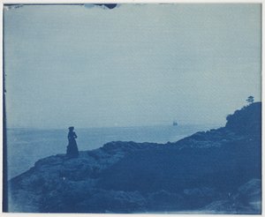 Žena sleduje škuner ze skalnatého mysu od American Photographer
