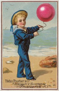 Sailor Boy drží červený balónek od American School