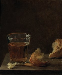 Sklenice piva a houska na stole