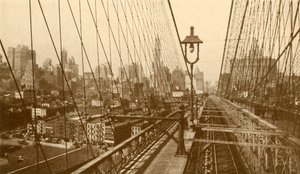 Dolní Manhattan při pohledu přes síť kabelů na visutý most v Brooklynu, c1930. od ENA