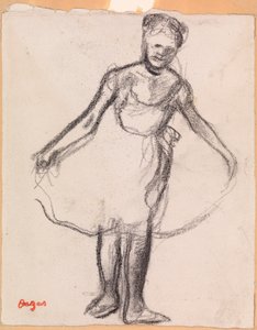 Stojící tanečnice držící Tutu sukni od Edgar Degas