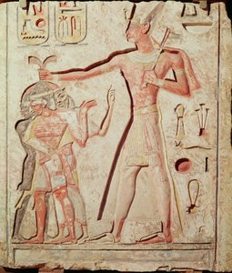 Ramses (1279 - 1213 př. n. l.) bijící své nepřátele (malovaný vápencový reliéf, 19. dynastie)
