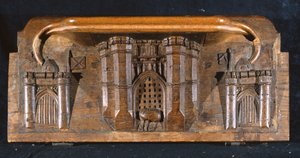 Misericord zobrazující koně Sira Yvainse uvězněného, když se spouští padací mříž propracovaného vstupu do hradu, New College Chapel, Oxford, konec 14. století (dřevo)