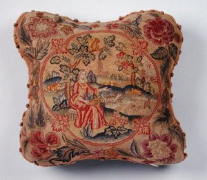 Polštář, vyšívaný petit point, zobrazující ženu v krajině (textil) od English School