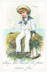 Sailor chlapec sedí na skalách, vánoční přání od English School