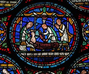 Okno s6 zobrazující scénu z okna St Thomas Becket Miracle: Cicely z Plumstead(?) sedí na máru od English School