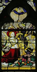 Okno zobrazující modlící se svatou Kateřinu a anděly lámající kolo házením kamenů, 1460-70 od French School