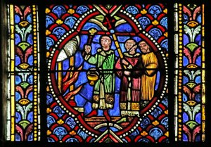Okno zobrazující scénu ze života Saint Artheme: Požár ve městě Clermont si vyžádal přesun relikvií svatých. Průvod nese relikviář a přichází k ohni a b od French School
