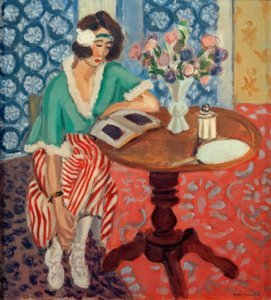 Žena čtoucí u stolu ((v zelených, červených pruhovaných šatech) od Henri Matisse