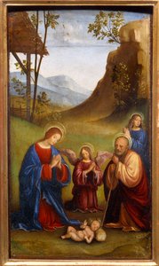 Uctívání dítěte. Svatý Josef, Panna Maria a anděl se modlí kolem nově narozeného Krista. Obraz Francesca Francia (1450-1517)