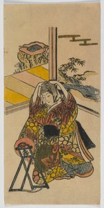 Mladá žena klečící vedle zrcadla, období Edo, 20. léta 18. století (barevný dřevotisk) od Japanese School
