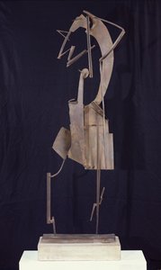 Žena aranžující si vlasy, 1929-30 (metal)