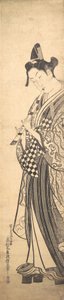 Mladý muž kráčí doleva na High Geta a hraje na flétnu při chůzi, ca. ..., ca. 1745. od Okumura Masanobu