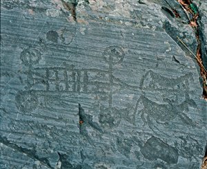 Prehistorie: civilizace Camunni: vůz vystřelený koňmi, kola jsou znázorněna paprsky a koně jsou z profilu ve snaze prospektovat. Skalní rytina skály 23 od Naquane (Valcamonica, Val Camonica, Brescia). Období mezi neolitem a br od Prehistoric Prehistoric