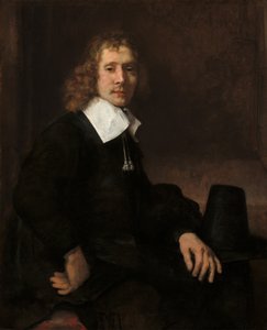 Mladý muž sedící u stolu pravděpodobně Govaert Flinck, c. 1660. od Rembrandt van Rijn