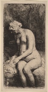 Akt sedící na lavičce s polštářem (žena si myje nohy u potoka) od Rembrandt van Rijn