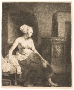 Žena sedí napůl oblečená vedle sporáku od Rembrandt van Rijn