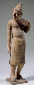 Čínské umění: Sogdian, barbarská terakotová soška se špičatým kloboukem nesoucím hedvábí (z dnešního Uzbekistánu). 6. nebo 8. století. Paříž, Cernuschiho muzeum od Sogdian Sogdian