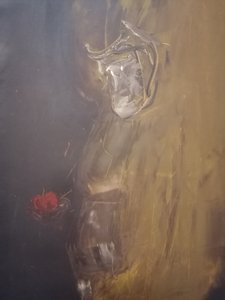 Zamyšlená postava s červeným jablkem od Stefano Mazzolini