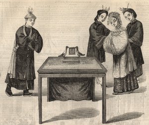 Čínský zvyk: podpis manželské smlouvy. Na stole se dvěma holubicemi je umístěna tabulka se jmény obou manželů. Rytina v „“The Illustrated London News““ ze 14. února 1857. od Unknown artist